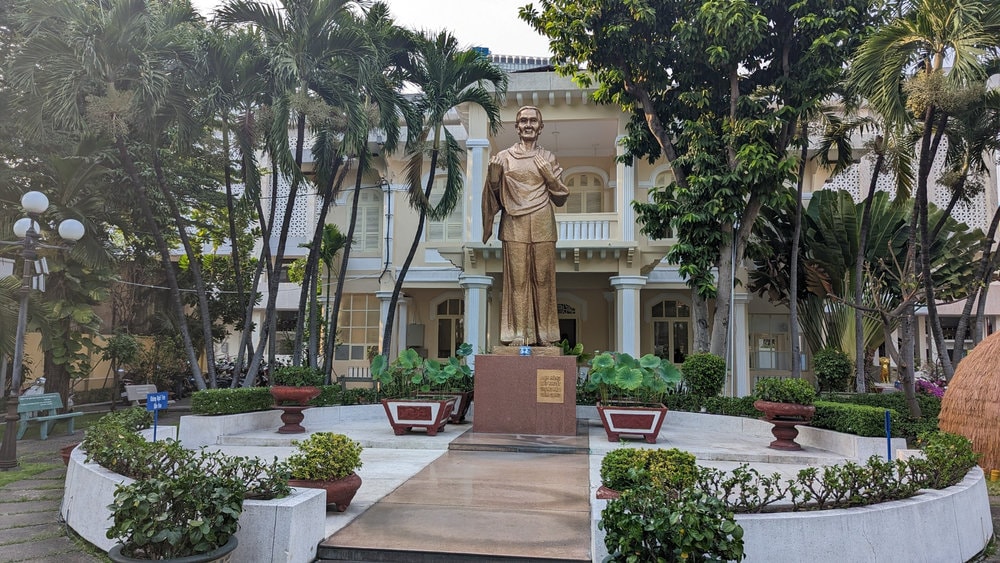 The statue of a Southern Vietnamese woman stands proudly in front of the museum, symbolizing resilience and sacrifice